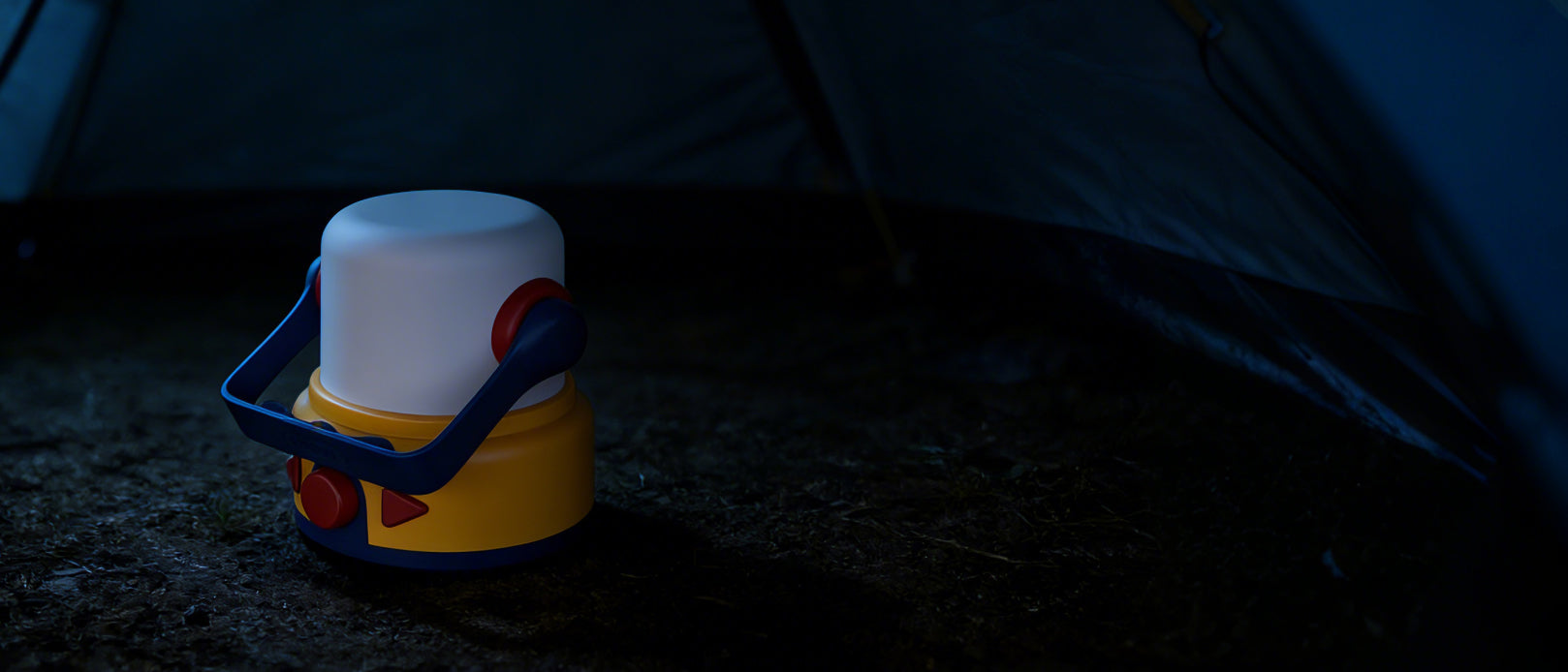 Using the CBPay mini lantern as a stable ground light at a campsite, lighting up the area around a tent in the dark